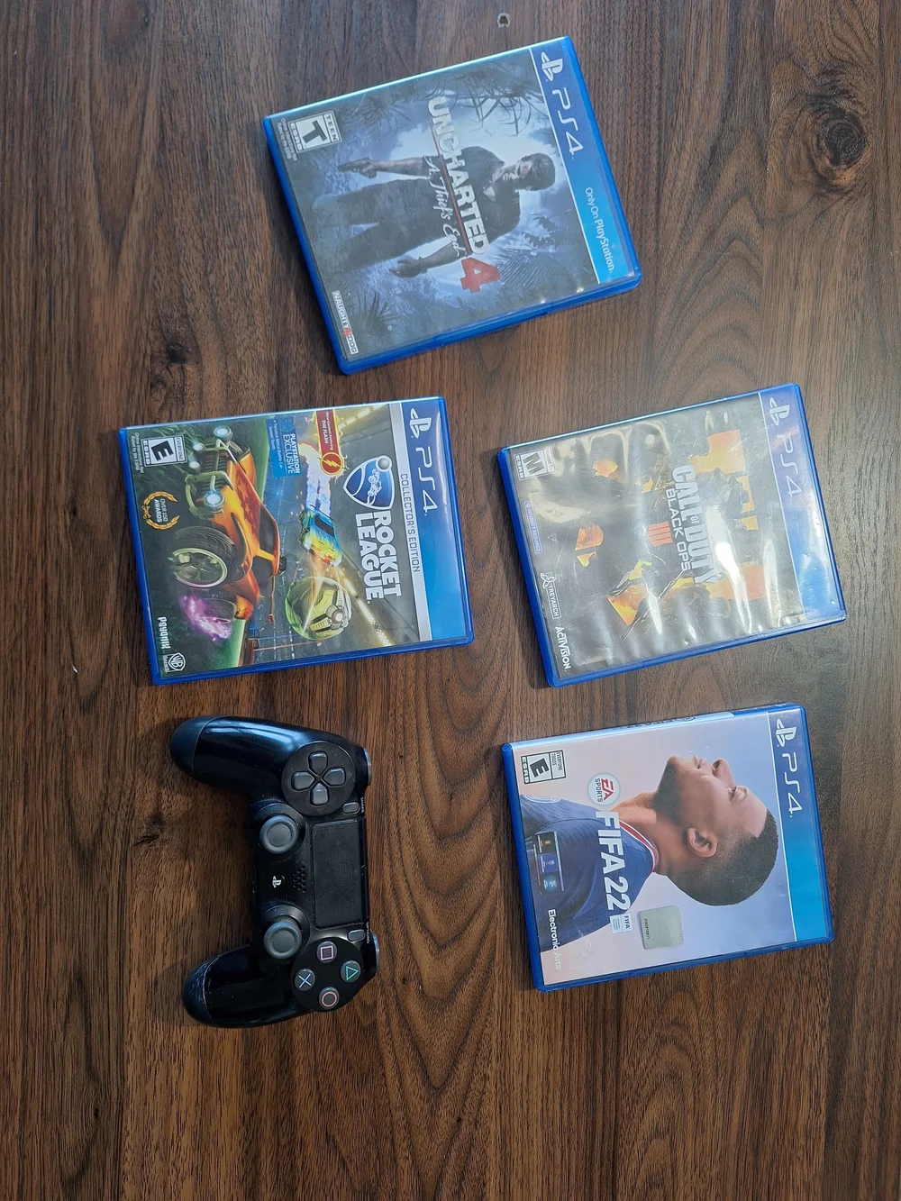 Sony PS4 Controller with Black Finish and Blue Game Cases Bundle